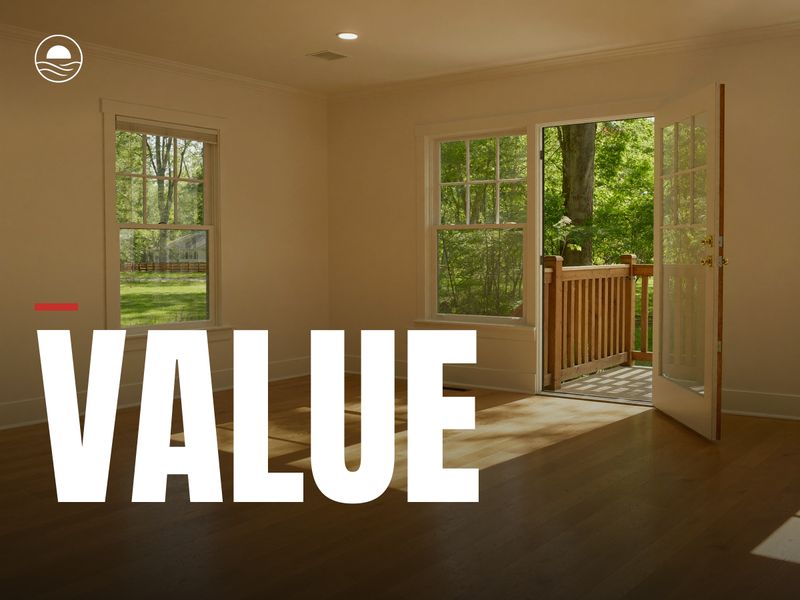 VALUE: a bright empty living room with sun across the oak floor